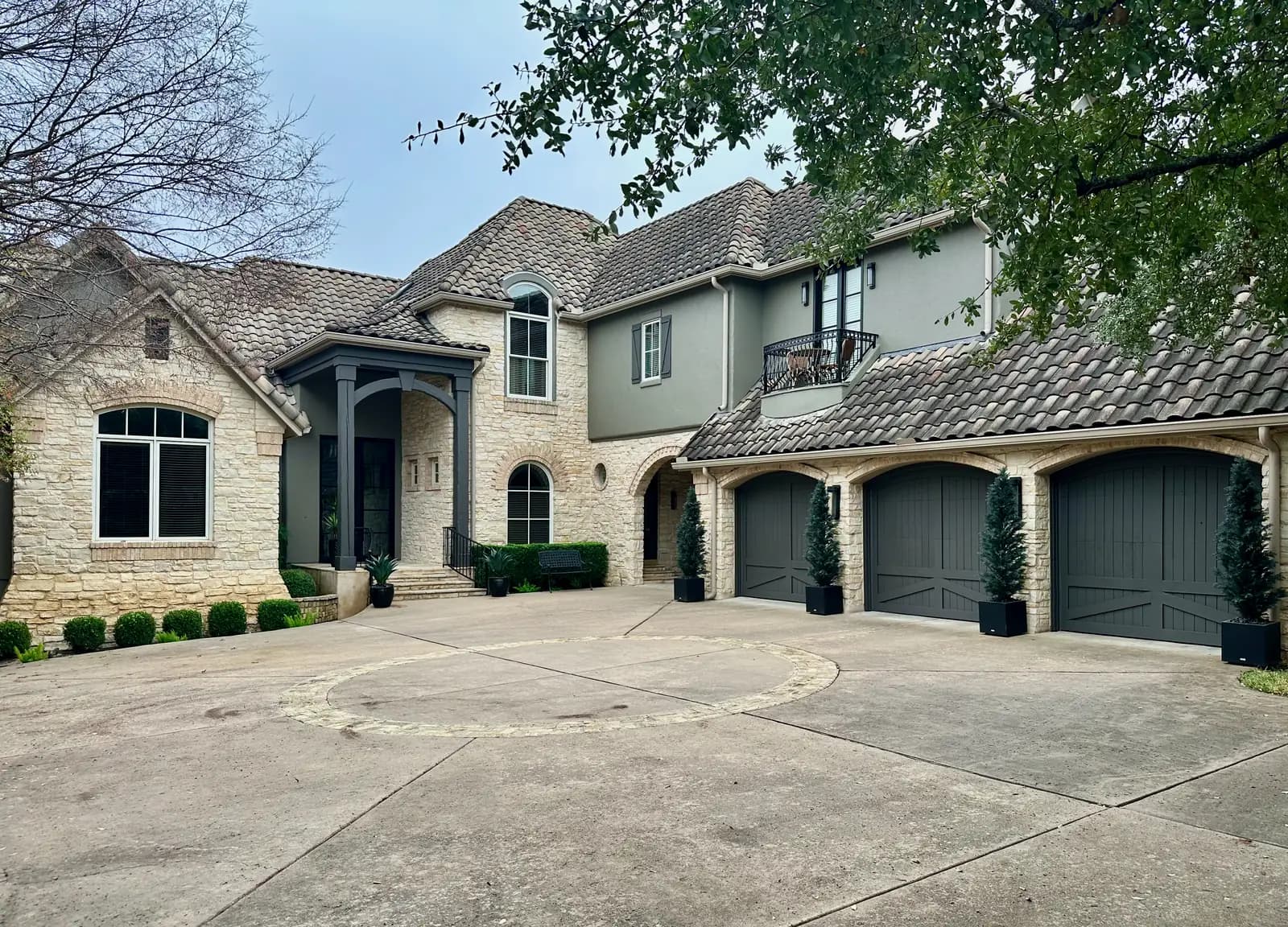 Mixed stone and stucco exterior entry painted by Ranger Painting
