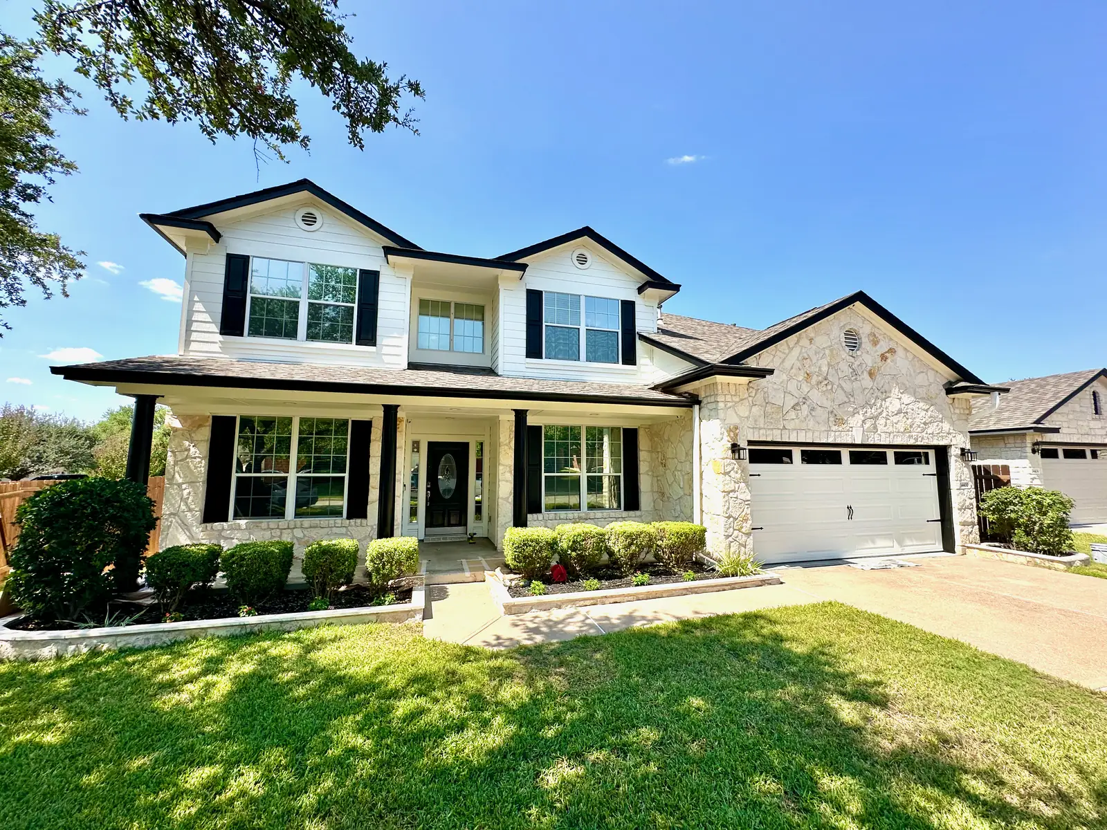 White and stone exterior painting project by Ranger Painting
